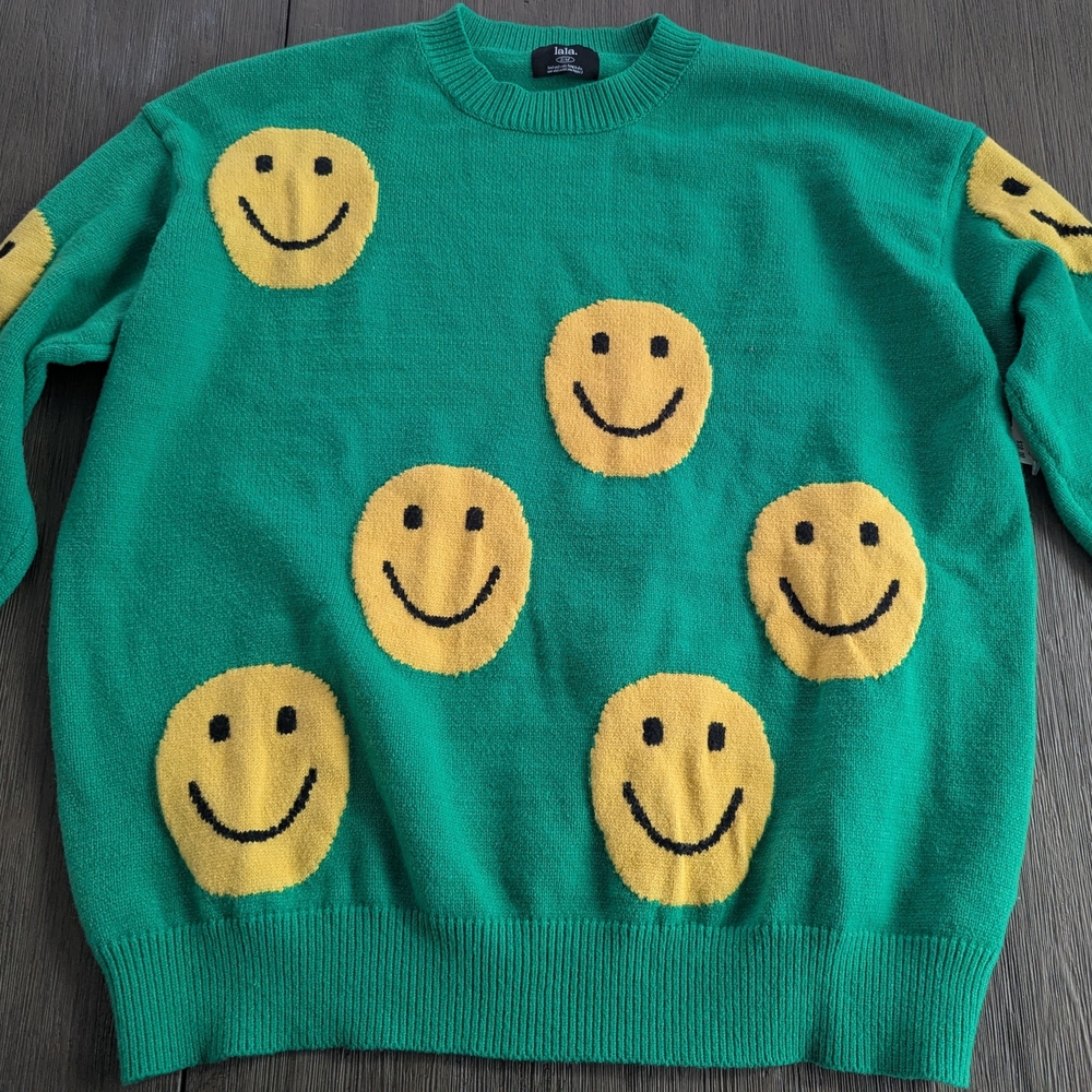 Dressed in LALA Green Sweater with Yellow Smiley Faces